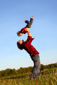 Father Lifting Up Son